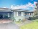Charming one-story home featuring a carport and well-maintained lawn at 202 Oakleigh Dr # 90, Deland, FL 32724