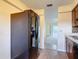 Updated kitchen with modern appliances and a view into the adjacent room at 202 Oakleigh Dr # 90, Deland, FL 32724