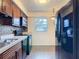 Modern kitchen featuring stainless steel appliances, ample counter space, and classic wood cabinetry at 202 Oakleigh Dr # 90, Deland, FL 32724