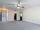 Cozy living room showcasing neutral tones, ample space, and easy access to other rooms at 202 Oakleigh Dr # 90, Deland, FL 32724