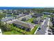 An aerial view showcases the community's well-maintained streets, attractive townhomes, and scenic lake backdrop at 206 Beautyberry Ln, Sanford, FL 32771