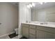 Bright bathroom features a double vanity with modern fixtures and a full mirror at 206 Beautyberry Ln, Sanford, FL 32771