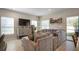 Cozy living room featuring a comfortable sectional and a view of the screened porch at 206 Beautyberry Ln, Sanford, FL 32771