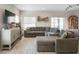 Spacious living room with large sectional, perfect for relaxing and entertaining at 206 Beautyberry Ln, Sanford, FL 32771