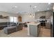 Inviting open-concept living space with island seating and ample natural light at 206 Beautyberry Ln, Sanford, FL 32771