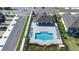 A clear blue swimming pool at the community with ample seating and a covered pavilion at 206 Beautyberry Ln, Sanford, FL 32771