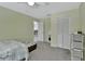 Comfortable bedroom with wood floors, neutral walls, and a closet at 230 White Dove Ave, Orange City, FL 32763