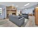Cozy living room features a brick fireplace, skylight, and comfortable seating at 230 White Dove Ave, Orange City, FL 32763