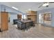 Bright and airy living room featuring a brick fireplace and access to the backyard at 230 White Dove Ave, Orange City, FL 32763