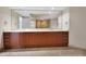 Bathroom featuring double sinks with sleek wood cabinets and a large mirror at 231 Riverside Dr # 1801-1, Daytona Beach, FL 32117