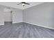A tranquil bedroom featuring a ceiling fan and light gray walls at 231 Riverside Dr # 1801-1, Daytona Beach, FL 32117