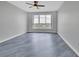 Bedroom showcasing a large window, scenic views, ceiling fan, and gray floors at 231 Riverside Dr # 1801-1, Daytona Beach, FL 32117