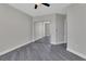 A serene bedroom features a ceiling fan, spacious closet, and sleek gray flooring at 231 Riverside Dr # 1801-1, Daytona Beach, FL 32117
