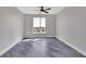 Bright bedroom with gray walls and wood flooring at 231 Riverside Dr # 1801-1, Daytona Beach, FL 32117