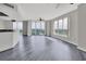 Bright living room with water views, wood-look floors, and lots of natural light at 231 Riverside Dr # 1801-1, Daytona Beach, FL 32117