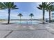Stunning waterfront pool with palm trees and picturesque views of the bay at 231 Riverside Dr # 1801-1, Daytona Beach, FL 32117
