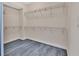 Walk-in closet showcasing custom shelving and ample storage space at 231 Riverside Dr # 1801-1, Daytona Beach, FL 32117