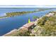 Waterfront home with a swimming pool boasts scenic views of the surrounding waterway and lush greenery at 2852 John Anderson Dr, Ormond Beach, FL 32176