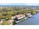 Waterfront home features a boat dock and is surrounded by lush greenery and beautiful waterways at 2852 John Anderson Dr, Ormond Beach, FL 32176