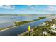 Stunning aerial perspective of riverfront house with private dock and waterway access with ocean access nearby at 2852 John Anderson Dr, Ormond Beach, FL 32176