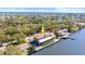 Waterfront home features a boat dock and is surrounded by lush greenery and beautiful waterways at 2852 John Anderson Dr, Ormond Beach, FL 32176
