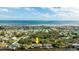 Picturesque aerial view of waterfront house with a pool and dock, situated between the river and ocean at 2852 John Anderson Dr, Ormond Beach, FL 32176