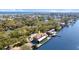 Beautiful aerial view of waterfront home with dock and canal access surrounded by mature trees at 2852 John Anderson Dr, Ormond Beach, FL 32176