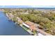 Waterfront home features a boat dock and is surrounded by lush greenery and beautiful waterways at 2852 John Anderson Dr, Ormond Beach, FL 32176