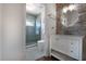 Stylist bathroom featuring glass enclosed shower, floating vanity, and eye-catching lighting at 2852 John Anderson Dr, Ormond Beach, FL 32176