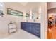 Bathroom showcasing double vanity, stylish lighting, and modern finishes at 2852 John Anderson Dr, Ormond Beach, FL 32176