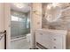 Modern bathroom featuring a glass-enclosed shower and vanity with elegant fixtures and tiling at 2852 John Anderson Dr, Ormond Beach, FL 32176