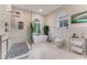 Bathroom featuring modern fixtures, walk-in shower, tub, and natural light at 2852 John Anderson Dr, Ormond Beach, FL 32176