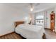 Bedroom with a ceiling fan and a window providing a view of the water at 2852 John Anderson Dr, Ormond Beach, FL 32176