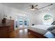 Bright bedroom with hardwood floors, waterfront views, and modern ceiling fan at 2852 John Anderson Dr, Ormond Beach, FL 32176