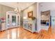 Inviting foyer with hardwood floors, a chandelier, and a view of the kitchen at 2852 John Anderson Dr, Ormond Beach, FL 32176