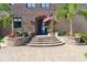Charming home exterior with a brick facade, an arched entryway with garden and stone walkway at 2852 John Anderson Dr, Ormond Beach, FL 32176