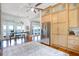 Open kitchen with water views, tall cabinets, and stainless-steel refrigerator at 2852 John Anderson Dr, Ormond Beach, FL 32176