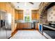 Well-equipped kitchen featuring custom cabinetry, modern appliances, and hardwood floors at 2852 John Anderson Dr, Ormond Beach, FL 32176