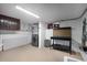 Clean laundry room with washer, dryer, storage, and folding table at 2852 John Anderson Dr, Ormond Beach, FL 32176