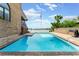Private in-ground pool with views of the water and mature landscaping at 2852 John Anderson Dr, Ormond Beach, FL 32176