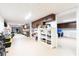 Large basement storage room with built-in shelving and ample storage space at 2852 John Anderson Dr, Ormond Beach, FL 32176