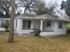 Charming single-story home featuring a white brick exterior and quaint front porch at 333 8Th St, Daytona Beach, FL 32117