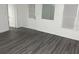 Spacious living area featuring laminate flooring and ample natural light from the windows at 333 8Th St, Daytona Beach, FL 32117