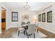 Inviting dining area featuring a decorative chandelier and lots of natural light at 3346 Pegaso Ave, New Smyrna Beach, FL 32168