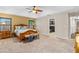 Spacious main bedroom with tray ceiling, ceiling fan, and natural light at 3346 Pegaso Ave, New Smyrna Beach, FL 32168
