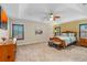 Spacious main bedroom with tray ceiling, ceiling fan, and natural light at 3346 Pegaso Ave, New Smyrna Beach, FL 32168