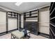 A well-organized walk-in closet, complete with custom shelving, drawers, and a comfortable seating area at 3346 Pegaso Ave, New Smyrna Beach, FL 32168