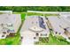 Bird's eye view showcasing the home's roof with solar panels and well-manicured lawn at 339 Spruce Pine Dr, Debary, FL 32713