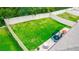 A well-maintained backyard enclosed with a white fence, showcasing a lush green lawn and trampoline at 339 Spruce Pine Dr, Debary, FL 32713