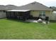 Spacious backyard featuring a patio, fire pit, and ample green space at 339 Spruce Pine Dr, Debary, FL 32713